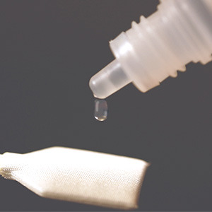 Apply two drops of Q+ sensor cleaning fluid to a fresh swab